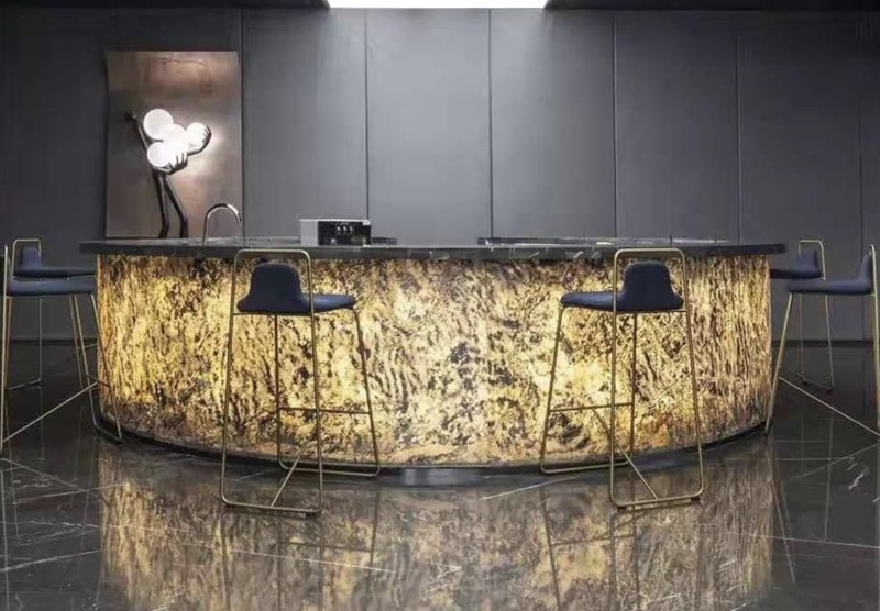 Backlit reception desk with uniform flexible LED sheet lighting